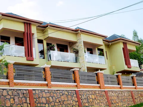 Wide view of the apartment building and its glass-fronted balconies